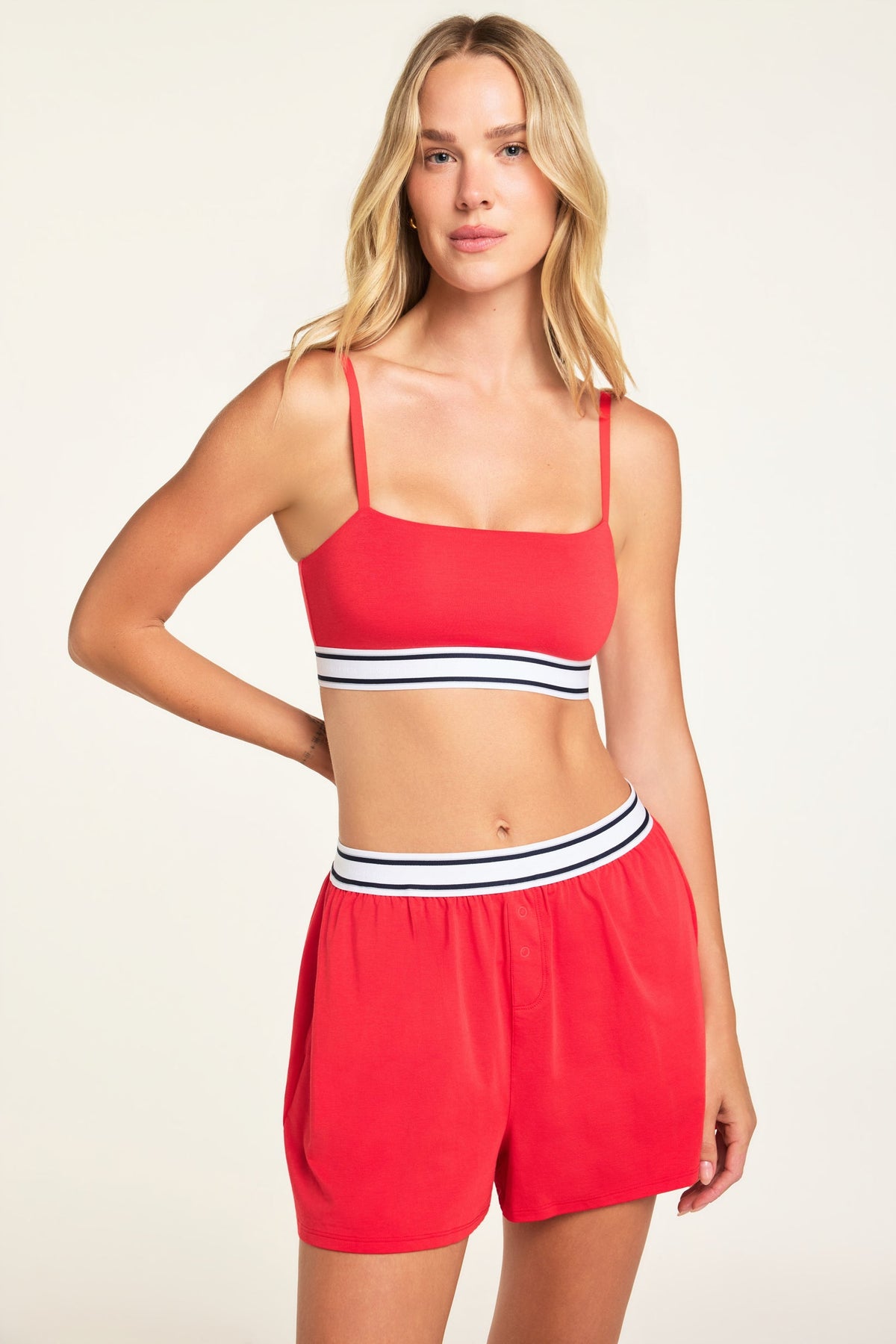Close-up detail of the Cloud Cotton Bandeau Bralette in Cherry paired with the Cloud Cotton Short in Cherry.